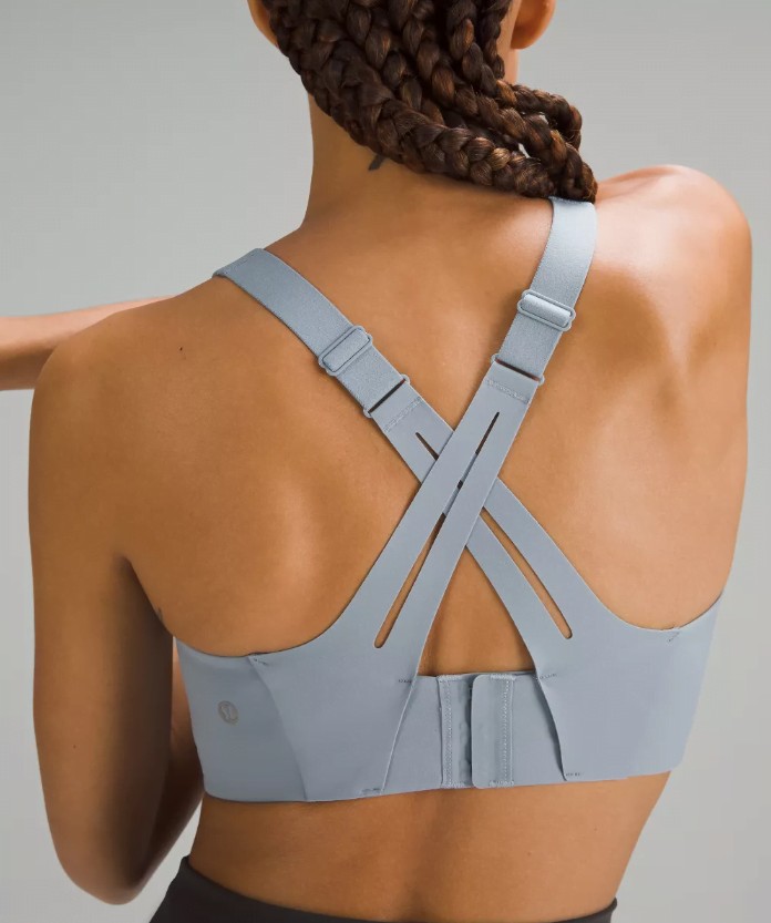 Lulu lemon sports bra back view of cross over strapes in light grey. C-DDD cups
